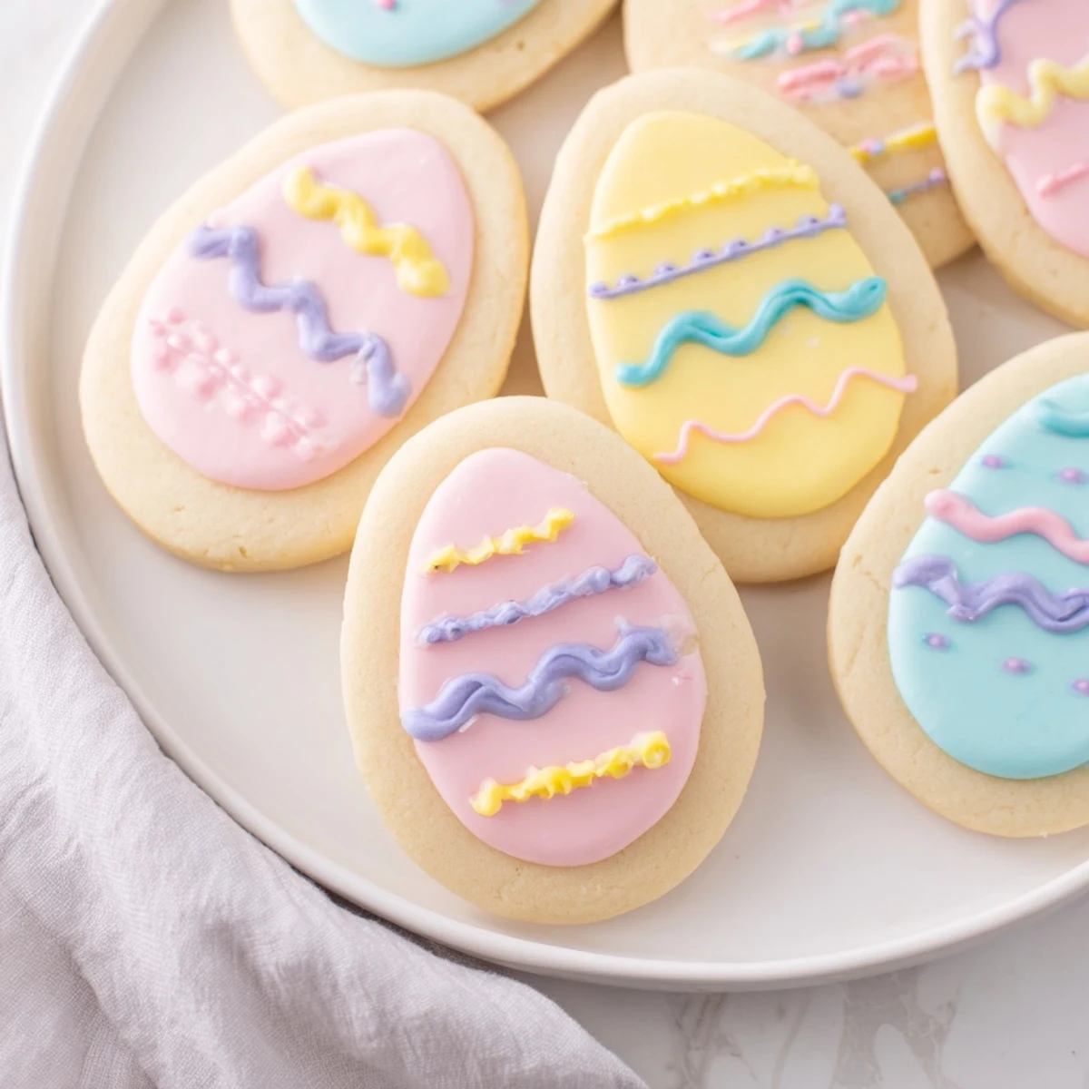 Close-up of decorated Easter Egg Sugar Cookies showing intricate icing details, making them an ideal festive dessert for Easter gatherings.