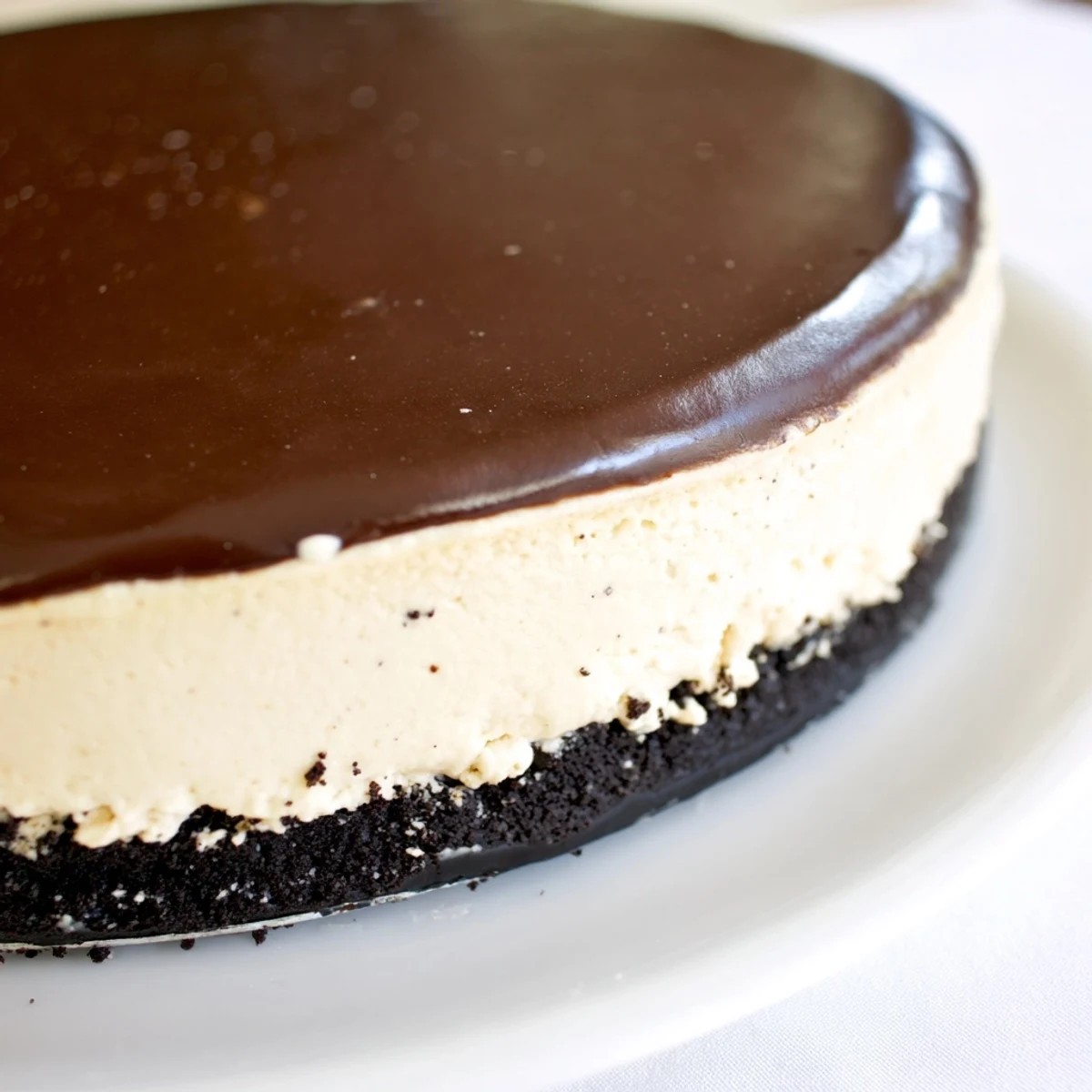 This chilled Irish Cream Cheesecake with Chocolate Ganache features a rich, creamy filling and smooth dark chocolate topping.