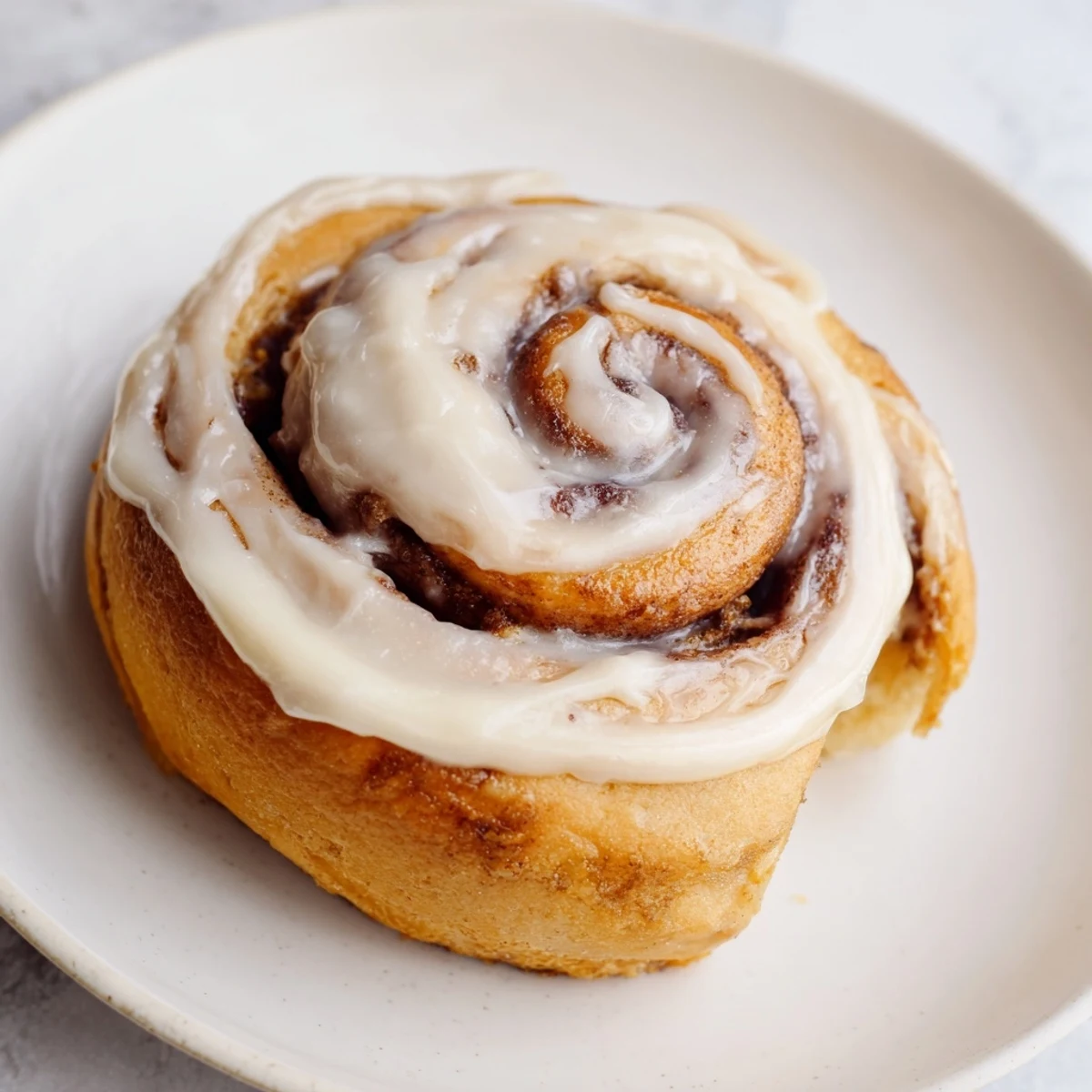 Warm Keto Cinnamon Buns fresh from the oven, showcasing a soft, fluffy texture and rich cinnamon filling.