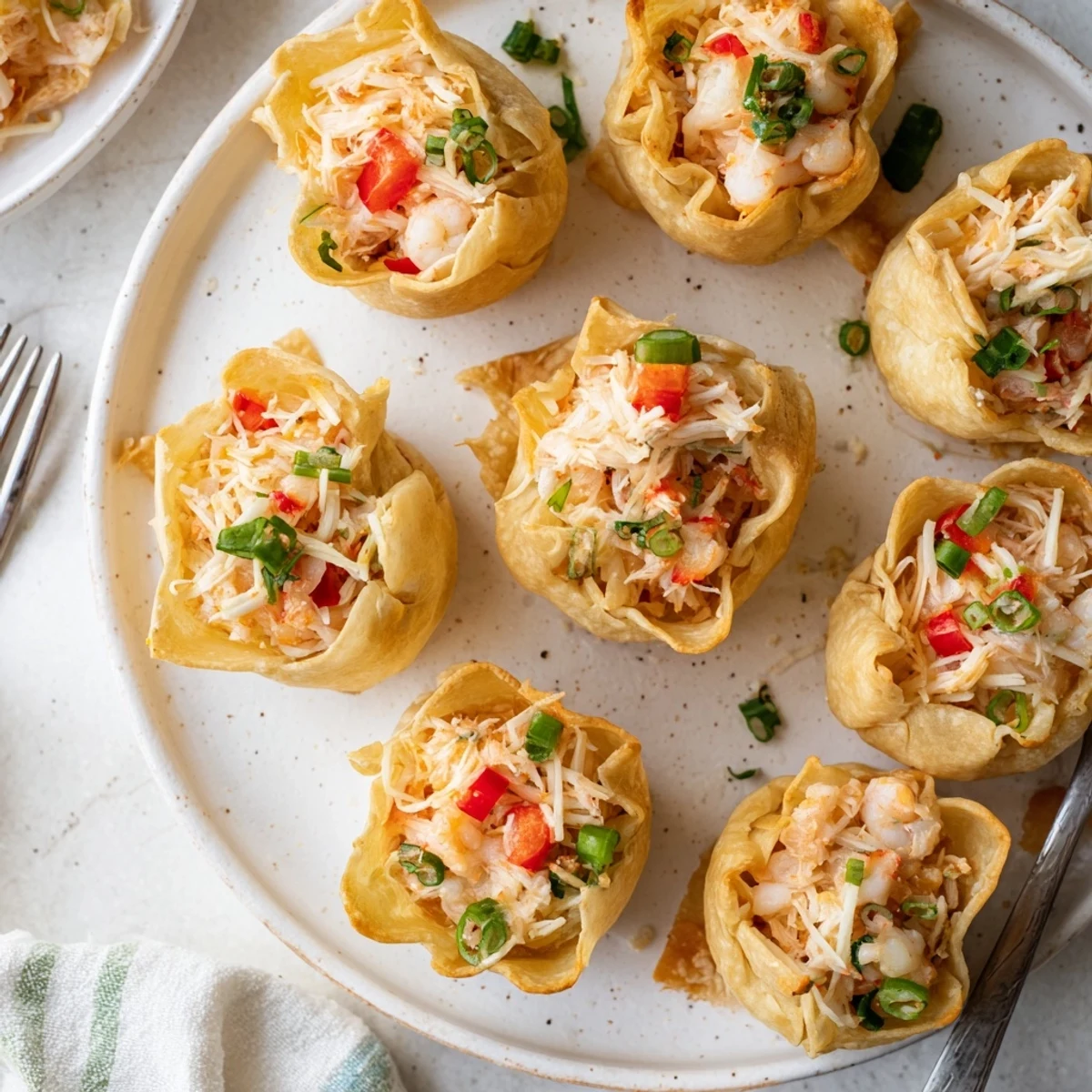 Close-up of Cheesy Seafood Tortilla Bombs, steam rising and melted cheese filling oozing out.