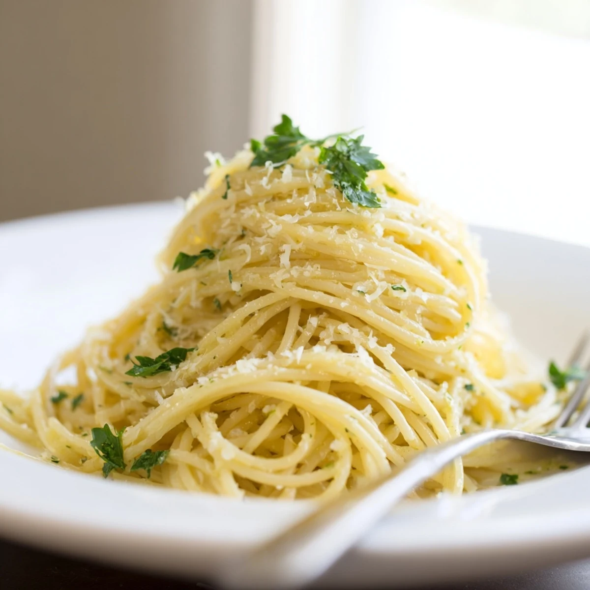 Creamy one pot garlic butter pasta coated in silky parmesan sauce with fresh parsley garnish