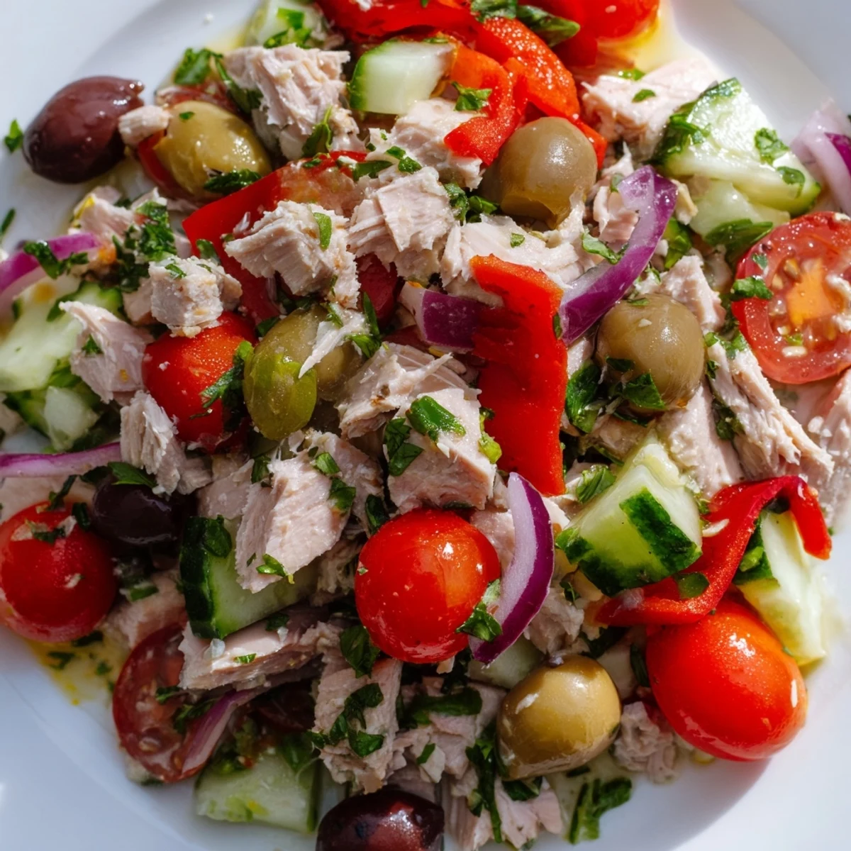 Simple Mediterranean Tuna Salad in a rustic bowl with bright cherry tomatoes and olives