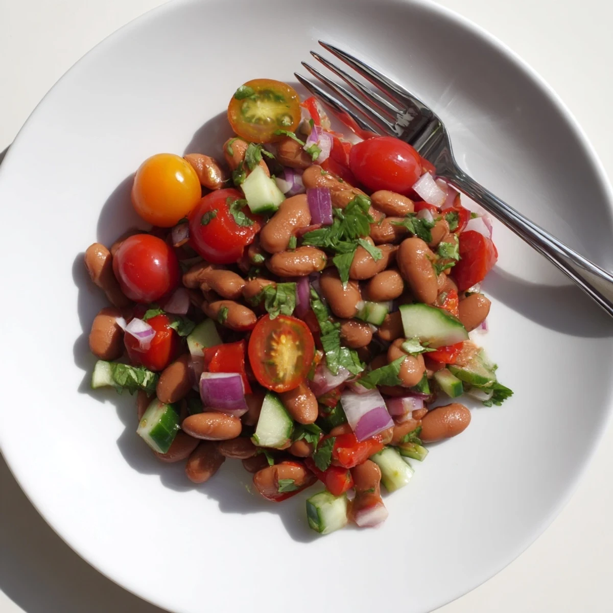 Tender pinto bean salad tossed with crisp veggies and zesty lime dressing