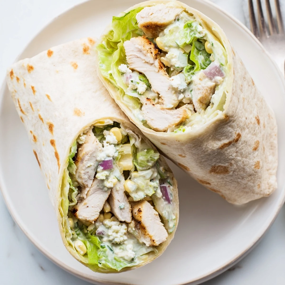Handheld Quick Mexican Street Corn Chicken Wraps filled with smoky chicken, tangy sauce