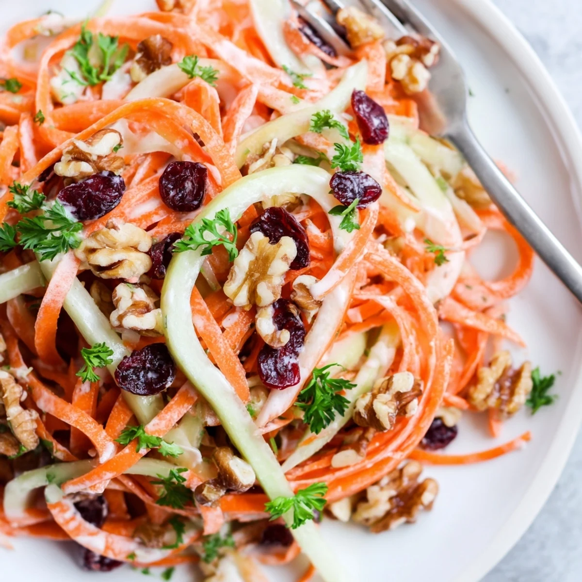 Brightly tossed Crunchy Apple Carrot Salad With Creamy Citrus Dressing, juicy apples, crisp carrots