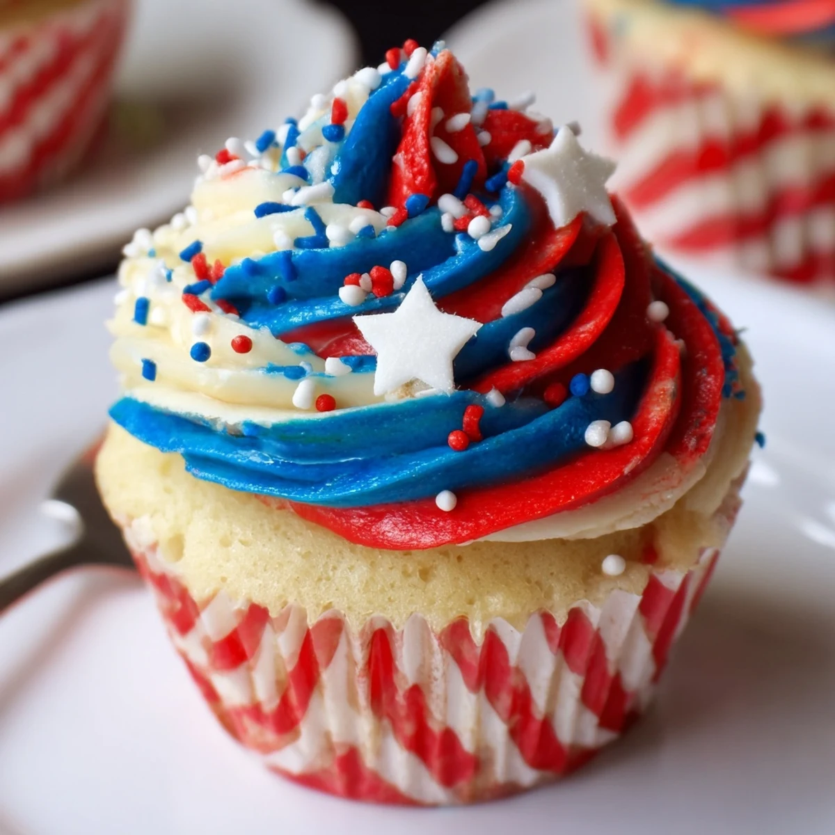 Freshly piped Patriotic Firework Cupcakes showing tall buttercream swirls, perfect with punch