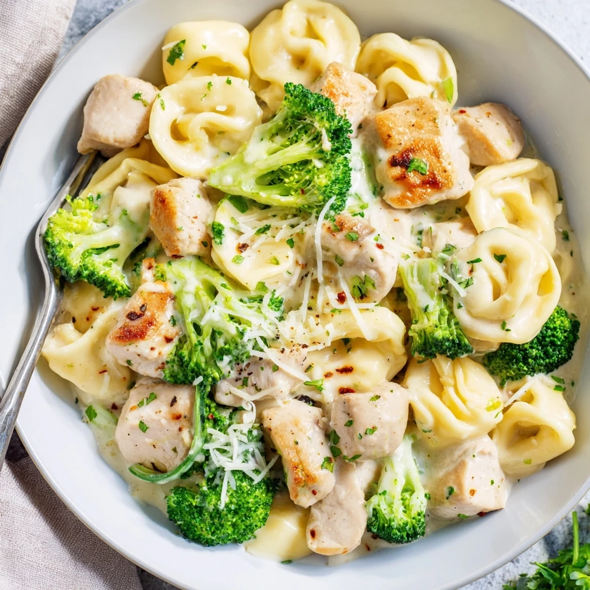 Creamy Garlic Parmesan Tortellini Chicken Broccoli Recipe skillet-tossed, aromatic garlic, cheese-sauced tortellini with chicken