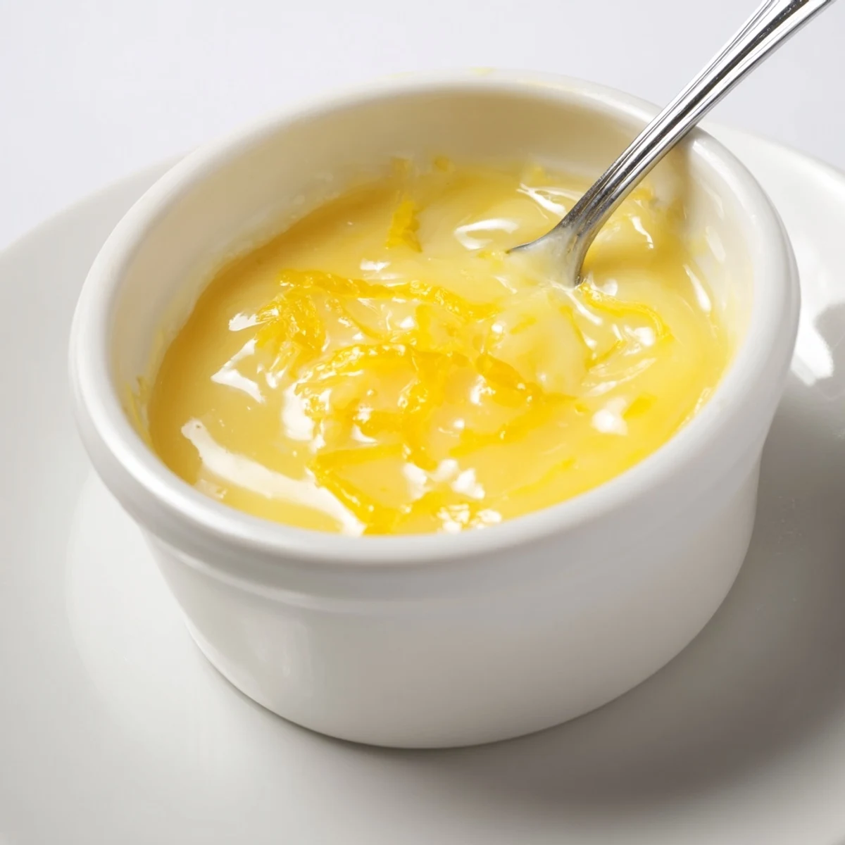 Velvety Lemon Curd Recipe spooned into jars, bright tart aroma, glossy surface