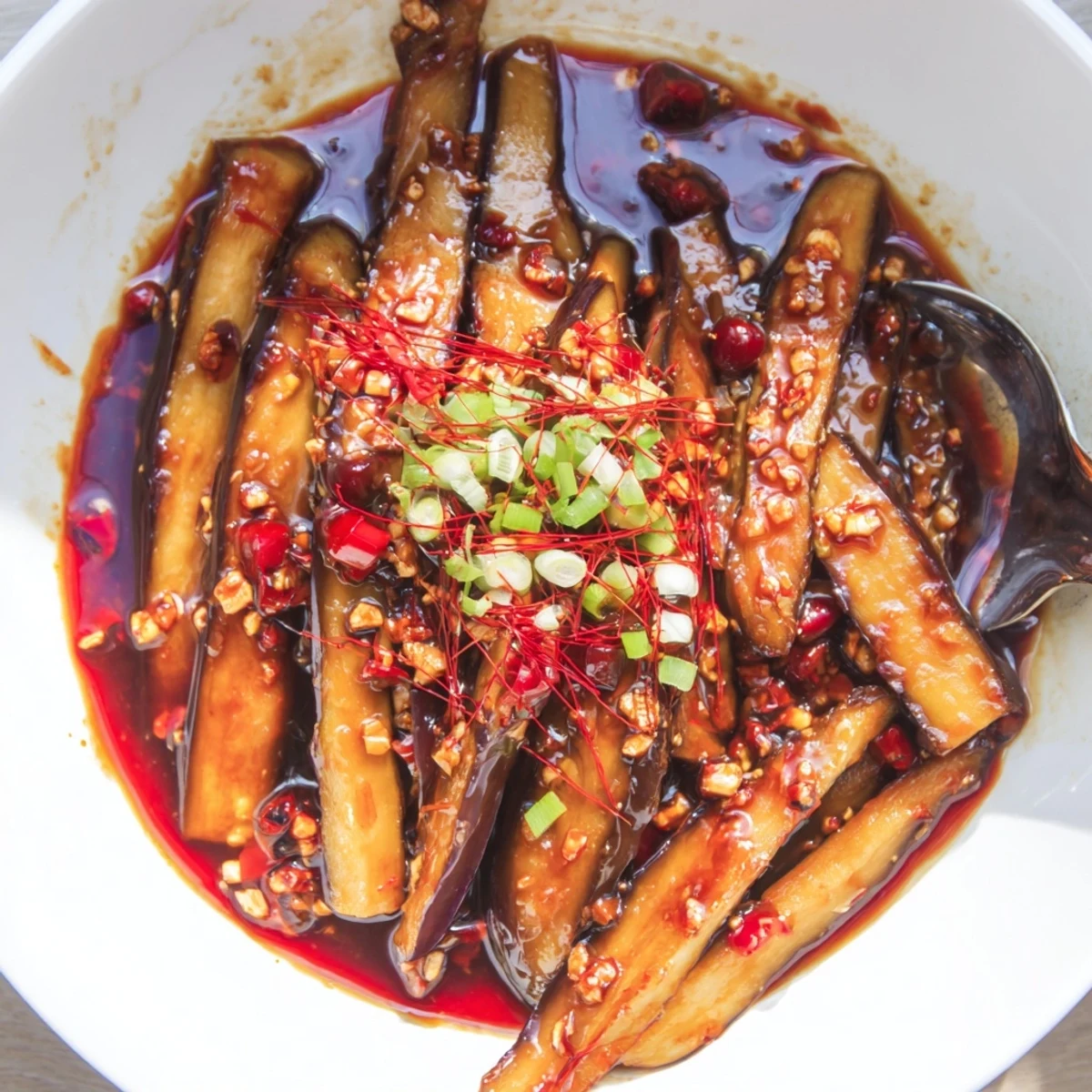 Sichuan Style Braised Aubergines spicy, glossy stir-fry served steaming alongside jasmine rice