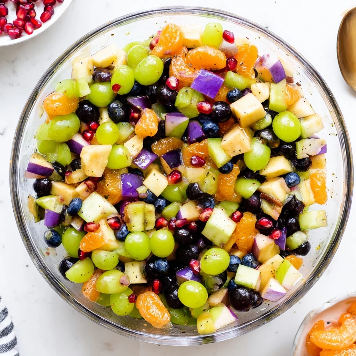 Fresh Halloween fruit salad arranged in glass serving dish with luscious honey orange topping