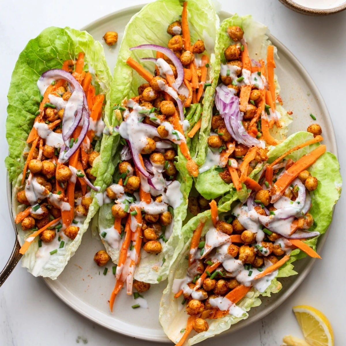 Crispy Buffalo Chickpea Lettuce Wraps with spicy chickpeas, crunchy celery, cooling ranch
