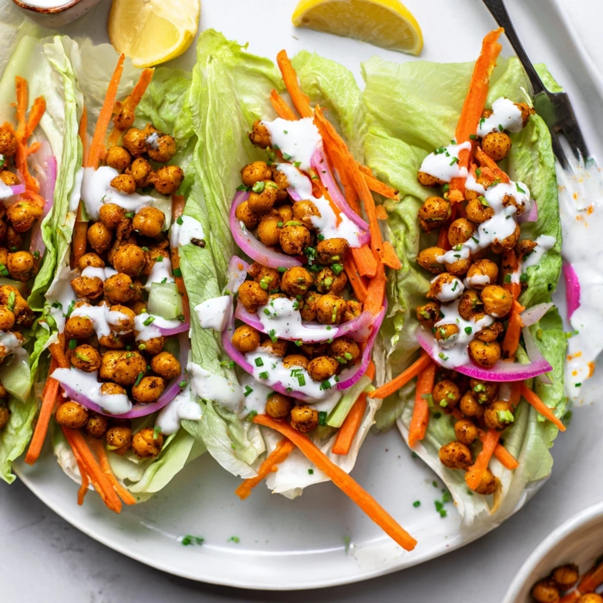 Serve Buffalo Chickpea Lettuce Wraps warm from skillet, tangy buffalo, lemon wedges