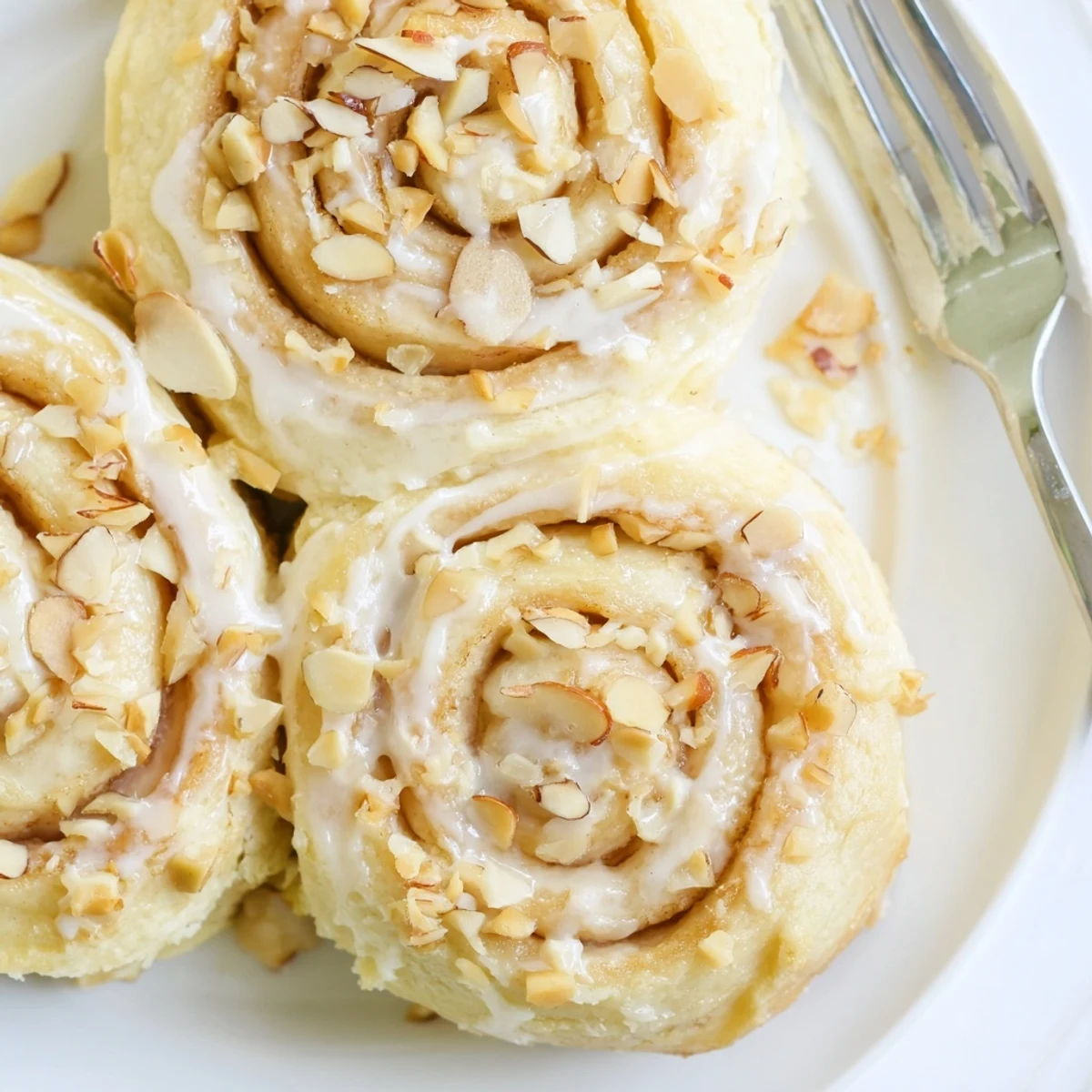 Warm Almond Cream Cheese Rolls sliced, cream cheese swirls and fragrant almond aroma