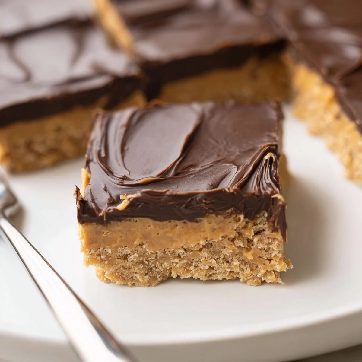 No bake Peanut Butter Bars with melty chocolate, cut into neat squares